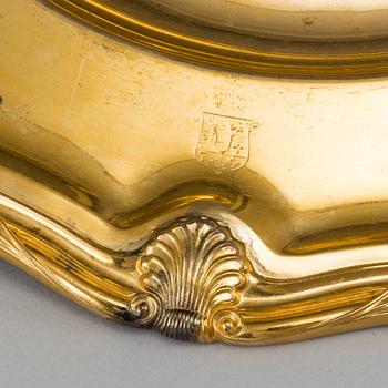 A German set of twelve 19th century silver-gilt plates, mark of Hossauer, Berlin. Rokoko-style.