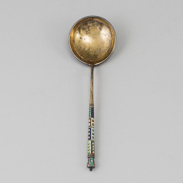 A Russian late 19th century silver-gilt and enameld caviar-spoon, mark possibly of Nicholai Pokrovsky, Moscow.