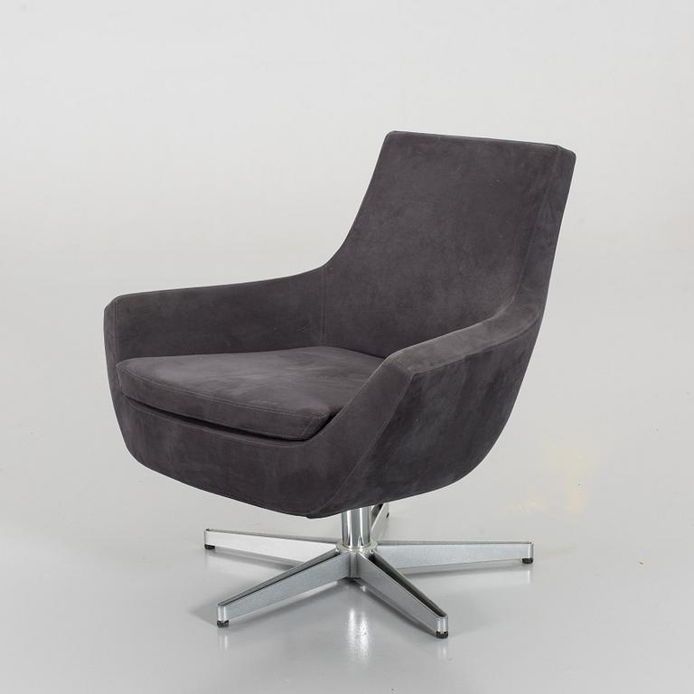 A SWEDESE SWIVEL ARMCHAIR.