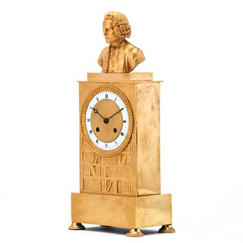 A late Empire first half 19th century gilt bronze mantel clock.