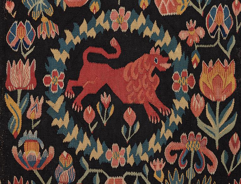 A cushion, 'Red Lion' (Rött Lejon), tapestry weave, c. 98 x 49 cm, Southwestern Scania, first part of the 19th century.