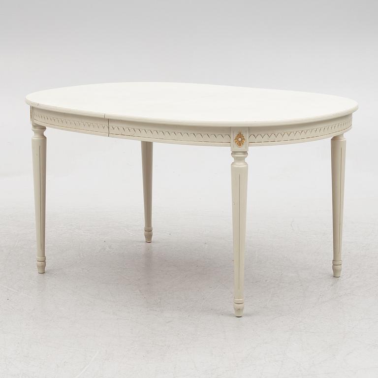 A Gustavian style dining table and eight chairs, late 20th century.