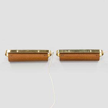 A pair of mid-20th century model 2317 wall lights by Valinte.
