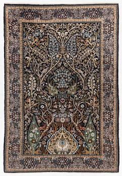 A figural Quum carpet, c. 179 x 125 cm.