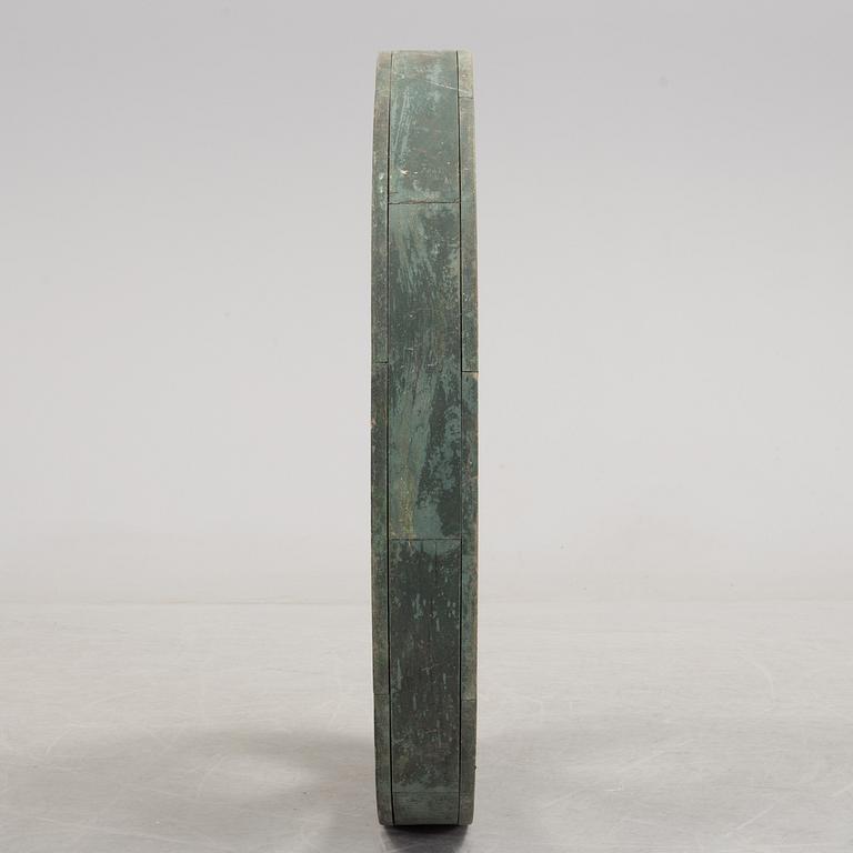 A early 20th century wooden wheel.