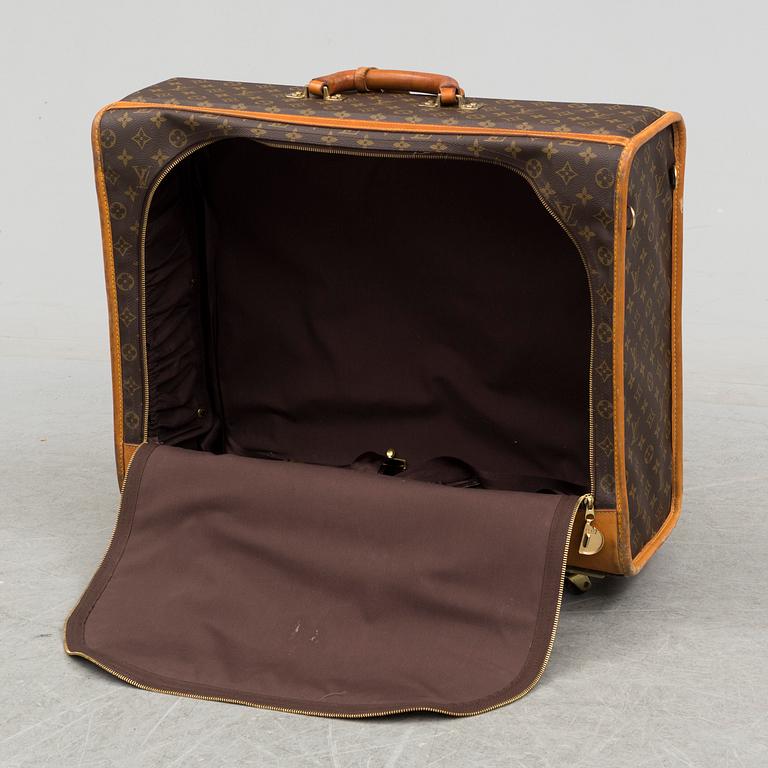 LOUIS VUITTON, a monogram canvas suitcase on wheels.