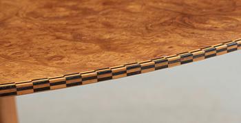 A Josef Frank mahogany and burrwood dining table, Svenskt Tenn, model 1020, checkered edges.