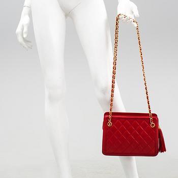 Handbag by Chanel.