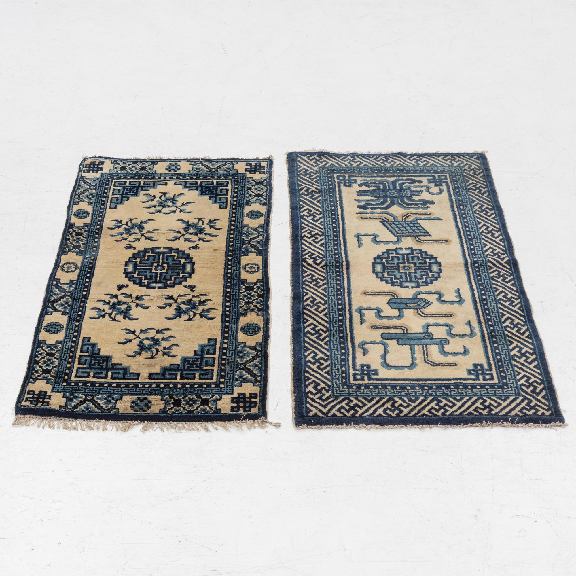 Two antique Chinese Pao-Tow rugs, c. 125 x 65 and 125 x 60 cm.