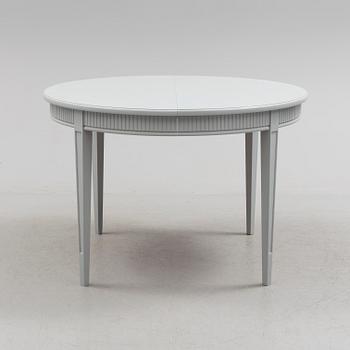 A Gustavian style dining table, mid 20th Century.