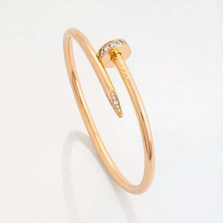 A Cartier "Juste en Clou" bracelet in 18K rose gold set with round brilliant-cut diamonds.