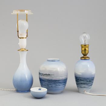 Two mid 20th century Royal Copenhagen porcelain table lights and a jar with lid.