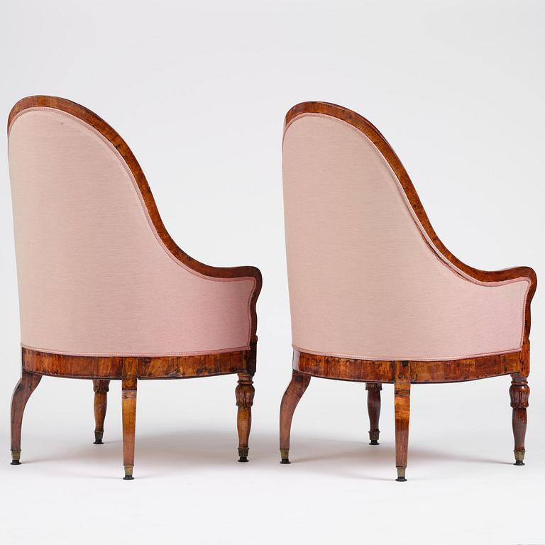 A pair of Baltic mahogany fauteuils, mid 19th century.