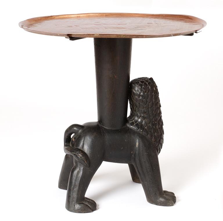 An Anna Petrus table, Sweden early 1920's. Sculptured oak with an engraved copper tray.