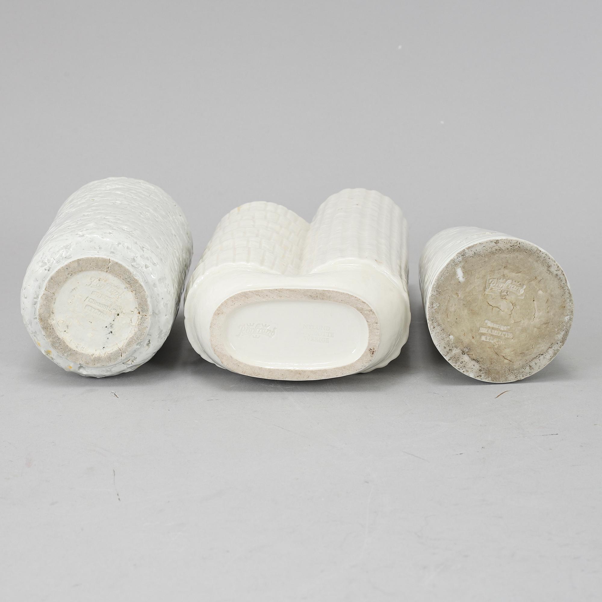 GUNNAR NYLUND, a set of three chamotte vases, Rörstrand.