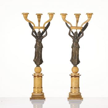 A pair of Empire ormolu and patinated bronze three-branch candelabra, possibly by R. F. Lindroth (1813-17).