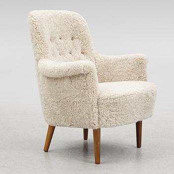 Carl Malmsten, a "husmor" armchair, O.H. Sjögren, Sweden, 1984.