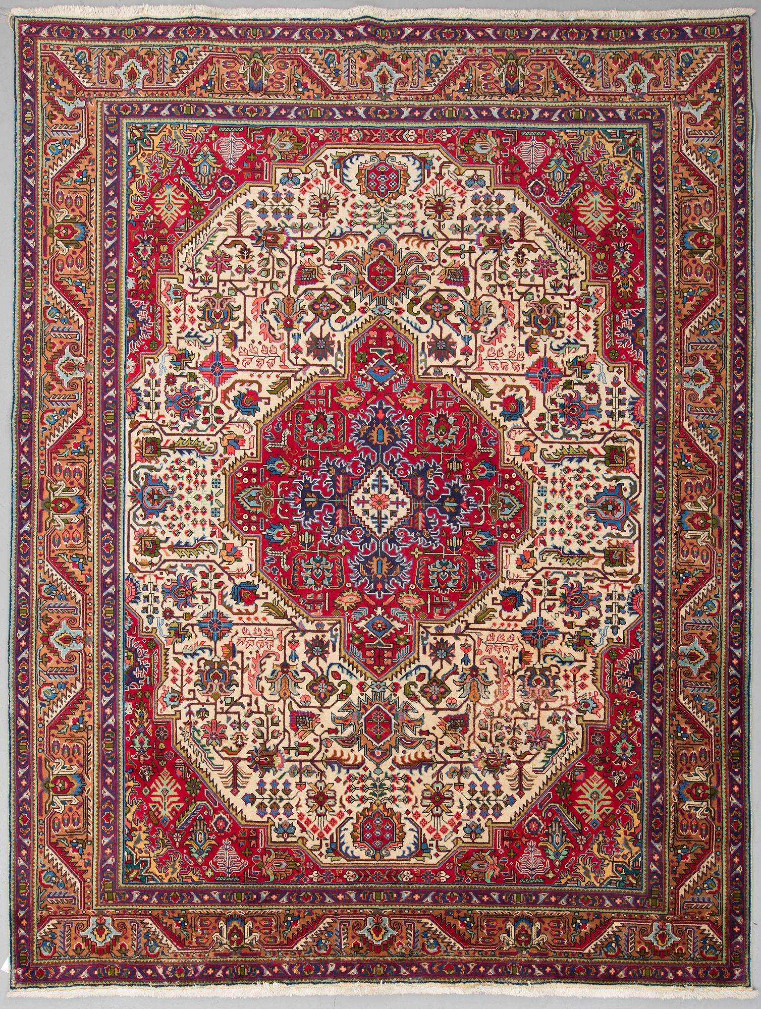 A carpet from Tabriz, around 388 x 294 cm.