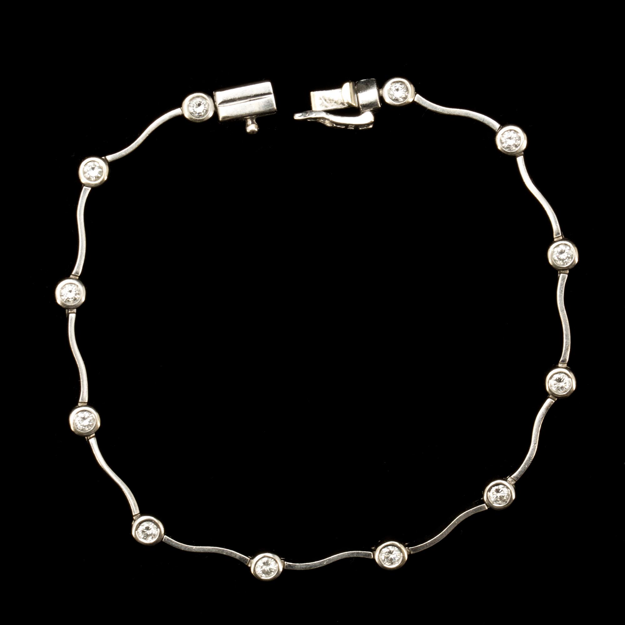 ARMLÄNK, 14k vitguld med briljantslipade diamanter ca 0,96 ct. Vikt 8g.