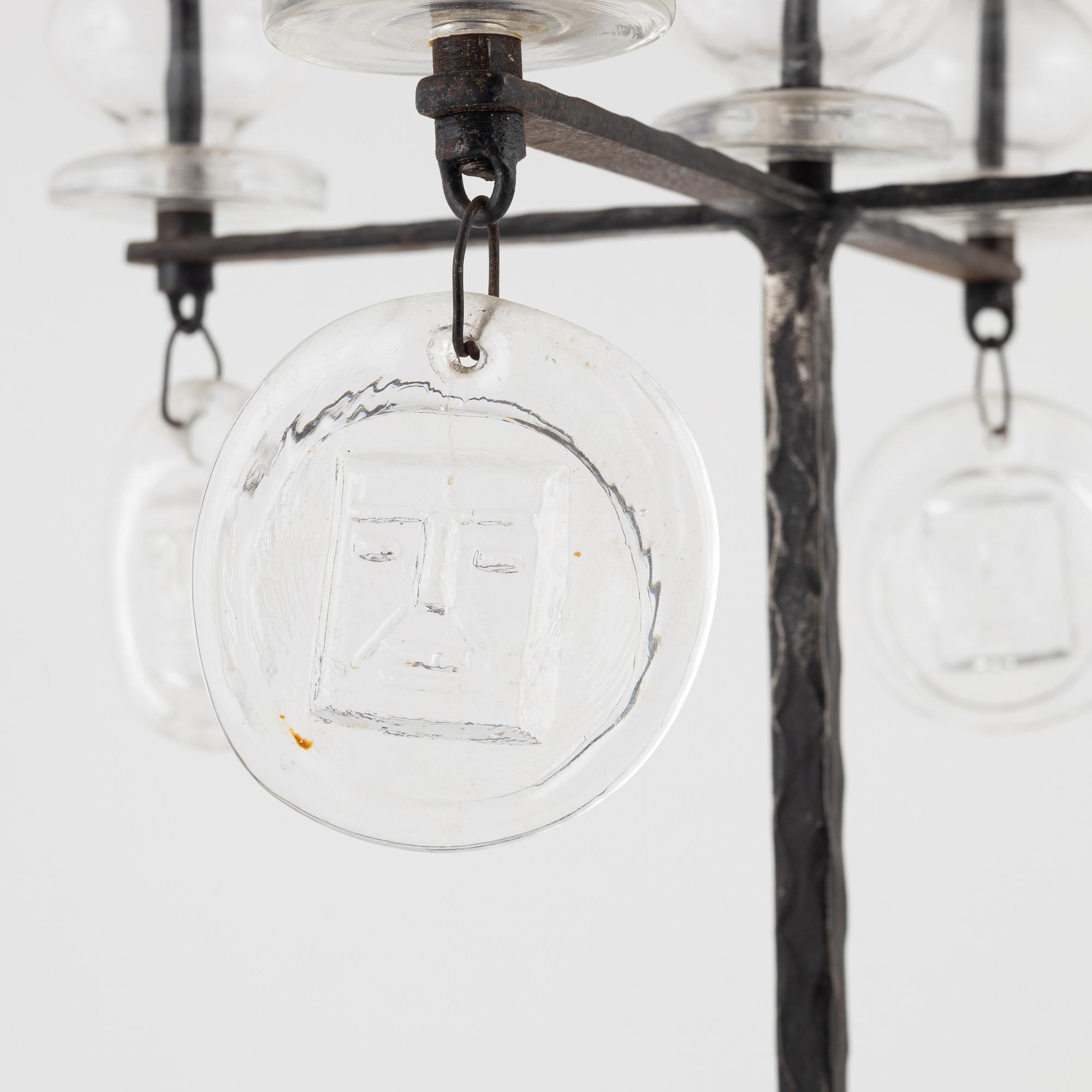 Erik Höglund, a iron and glass candelabra.