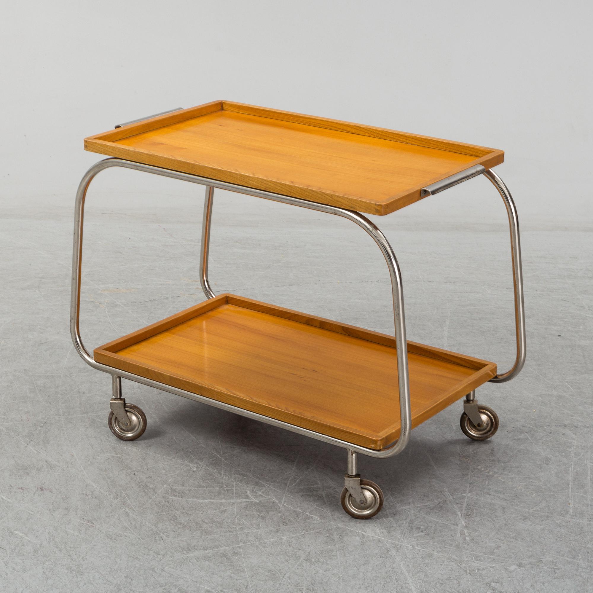 An elm and tubular steel drinks trolley, 1930's.