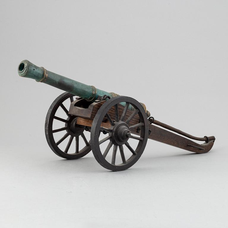 A copy of a field canon with monogram of king  Karl XII produced by Svensk Metallkonst, Carlscrona in late 20th century.