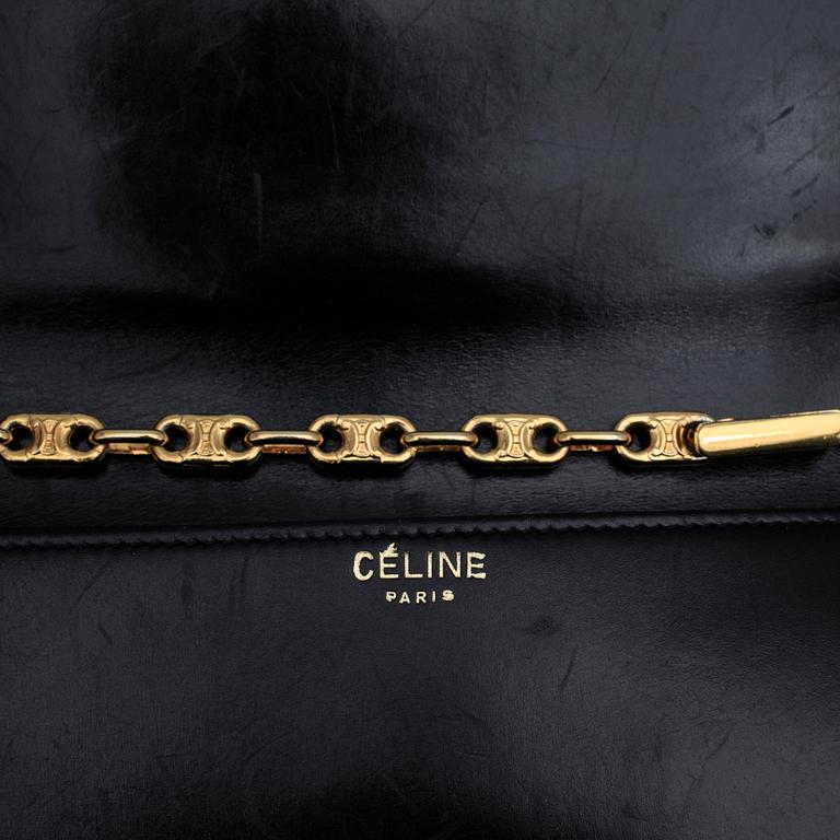 CÉLINE, a black leather evening bag.