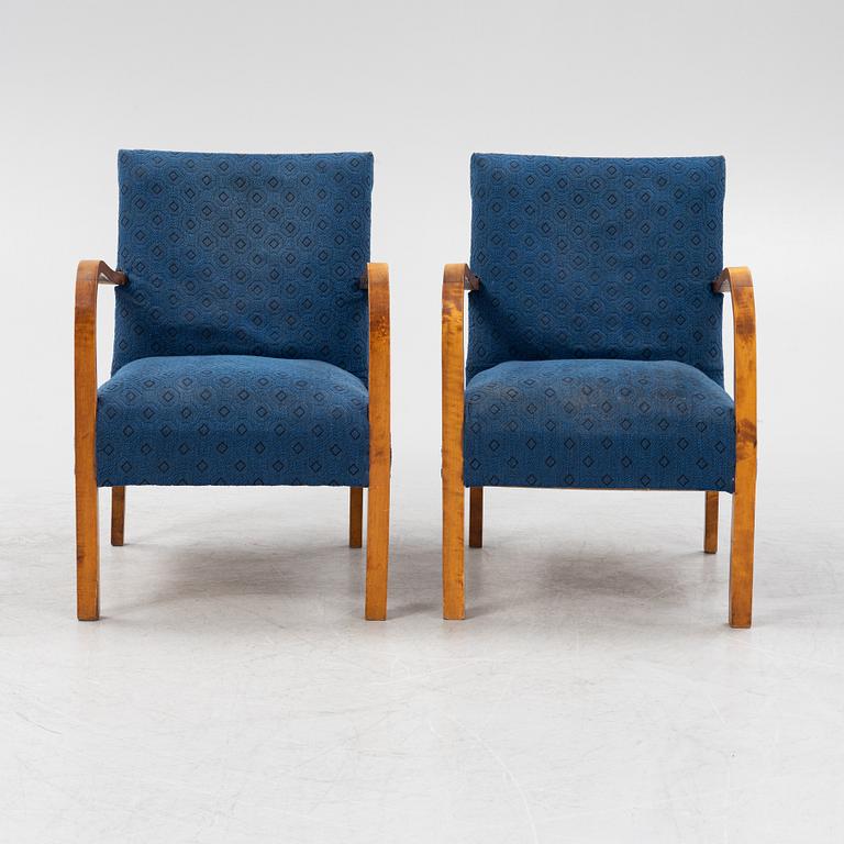 A a pair of stained birch armchairs 1930s-40s.