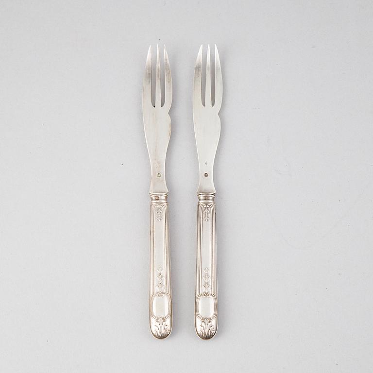 A set of twelve French 19th century silver lobster forks.