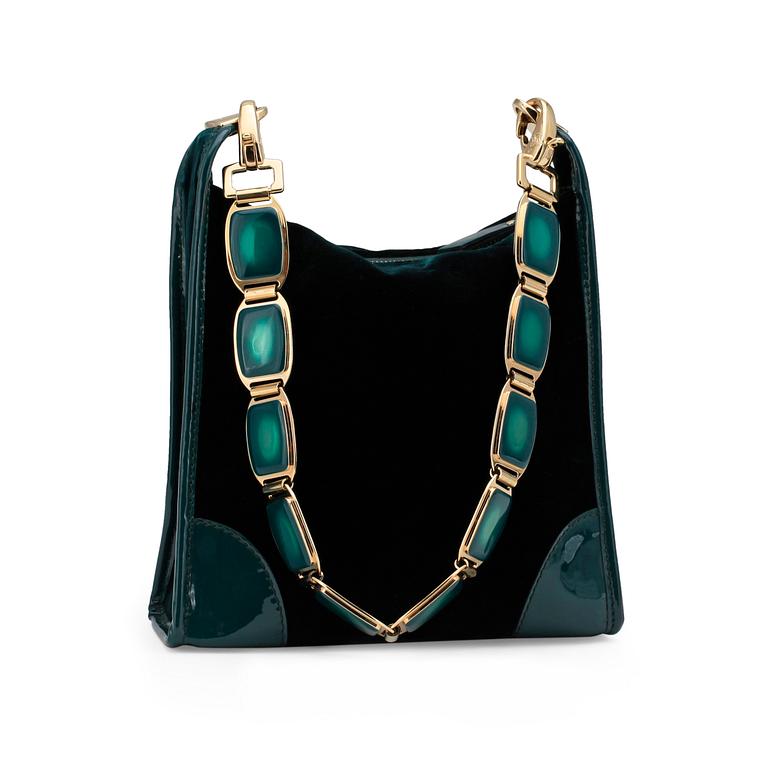 CÉLINE, a green velvet handbag.