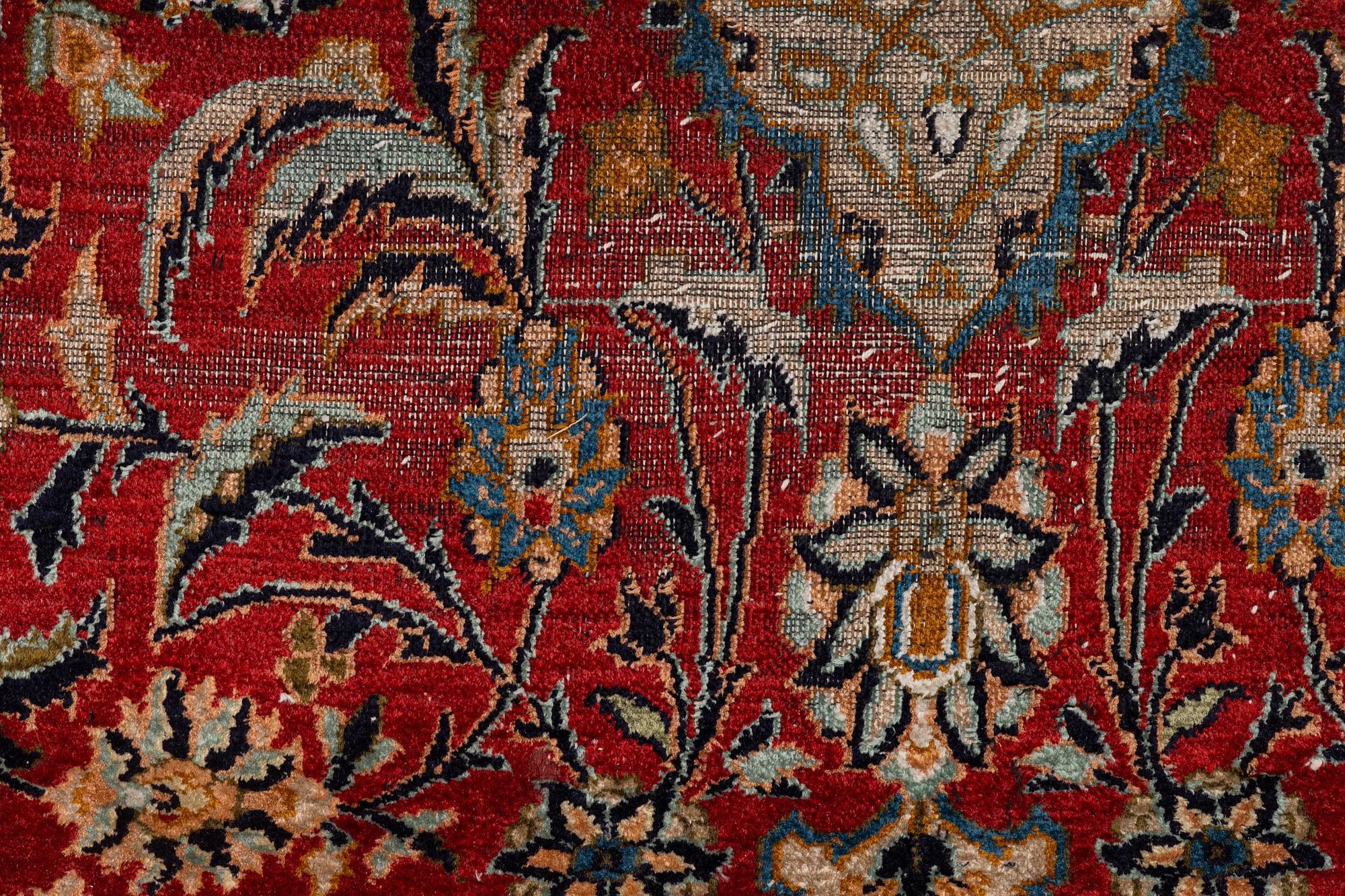 A silk Kashmir rug, c. 176 x 121 cm.