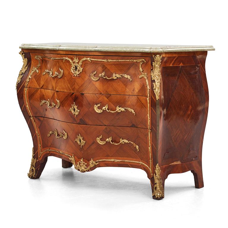 A rococo parquetry and ormolu-mounted commode attributed to L. Nordin (master 1743-1773).