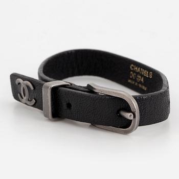 CHANEL, a leather bracelet.