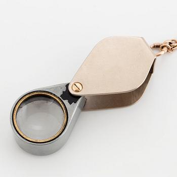 LOUPE, setting 18K white gold with 50X in diamonds, chain gold.