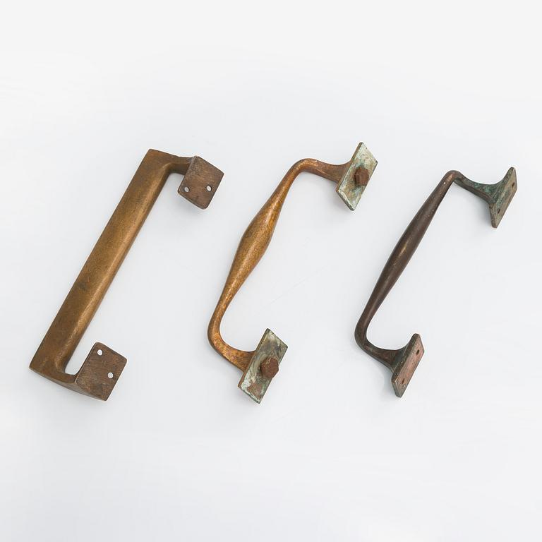 Door handles, three pieces, ca 1900 and 1960s.