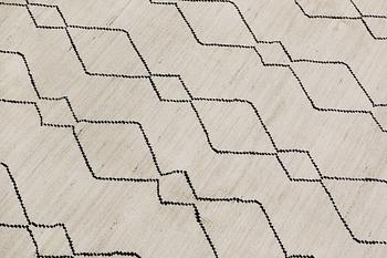 A Moroccan rug, approx. 292 x 203 cm.