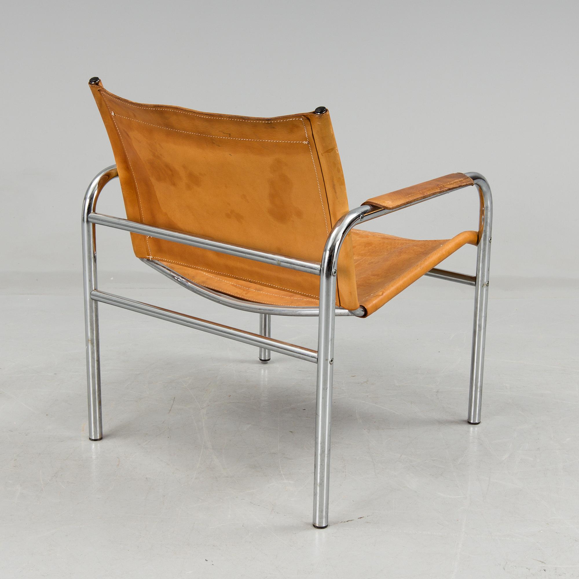 a leather and metal armchair, probably by IKEA.
