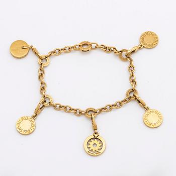 BVLGARI BRACELET w 5 charms (detachable), 18K gold and whitegold, onyx, mother-of-pearl, brilliant-cut diamonds 0,20 ct.