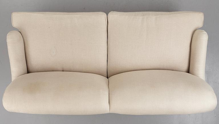 SOFA, "Howard", upholstered in an off-white fabric.
