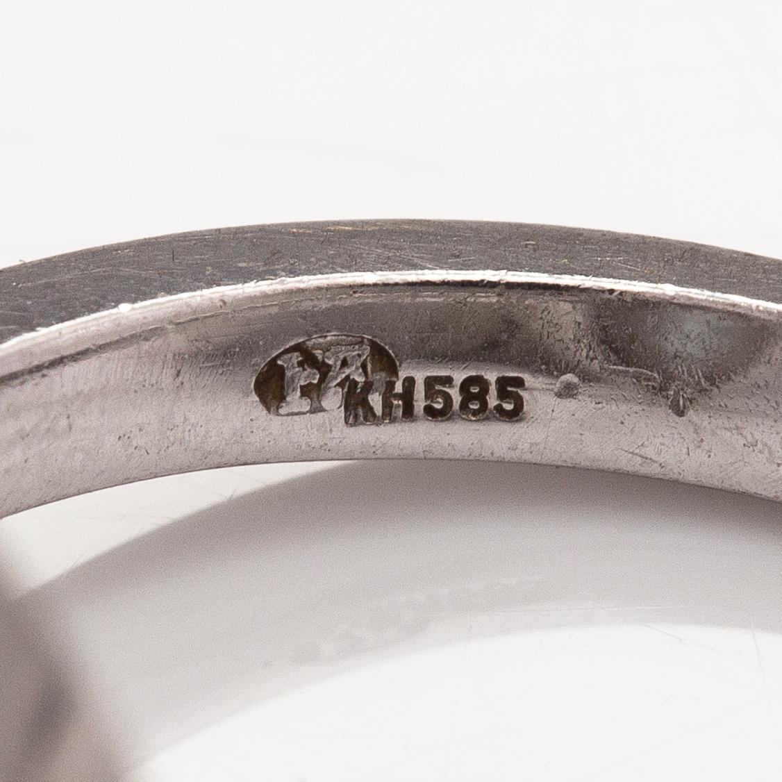 A 14K white gold ring with a topaz and diamonds ca. 0.12 ct in total. Faber art, Helsinki.