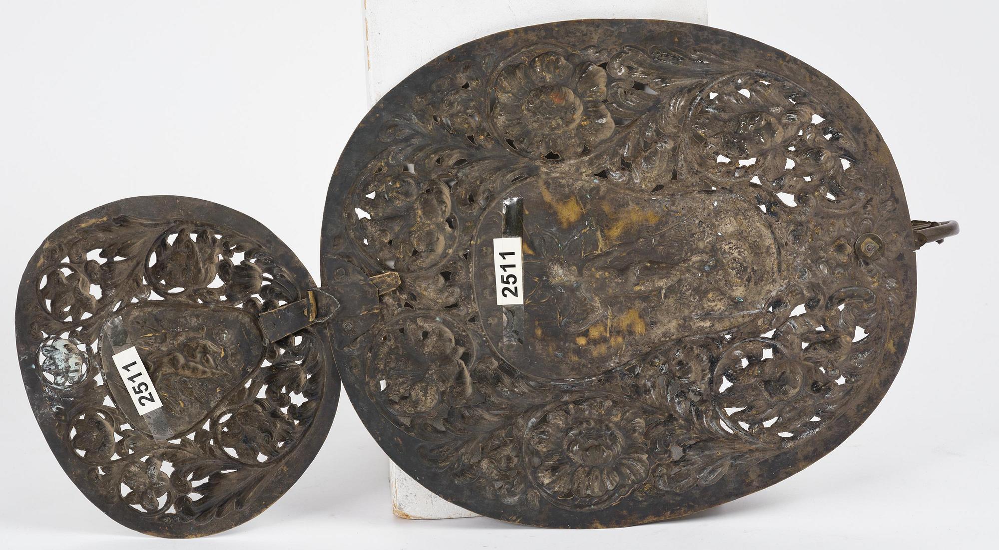 A set of four Swedish Baroque repoussé silvered brass reflector one-branch reflector plates, ca 1690-1700.