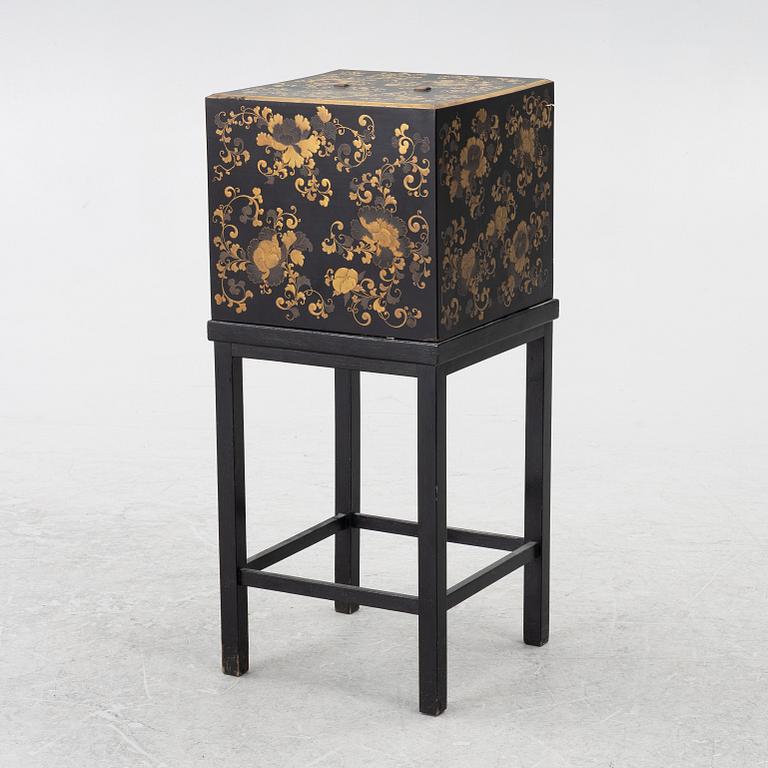 A lacquered end table/box with stand, Japan, 20th century.