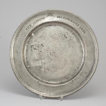 A pewter plate, dated 1787.