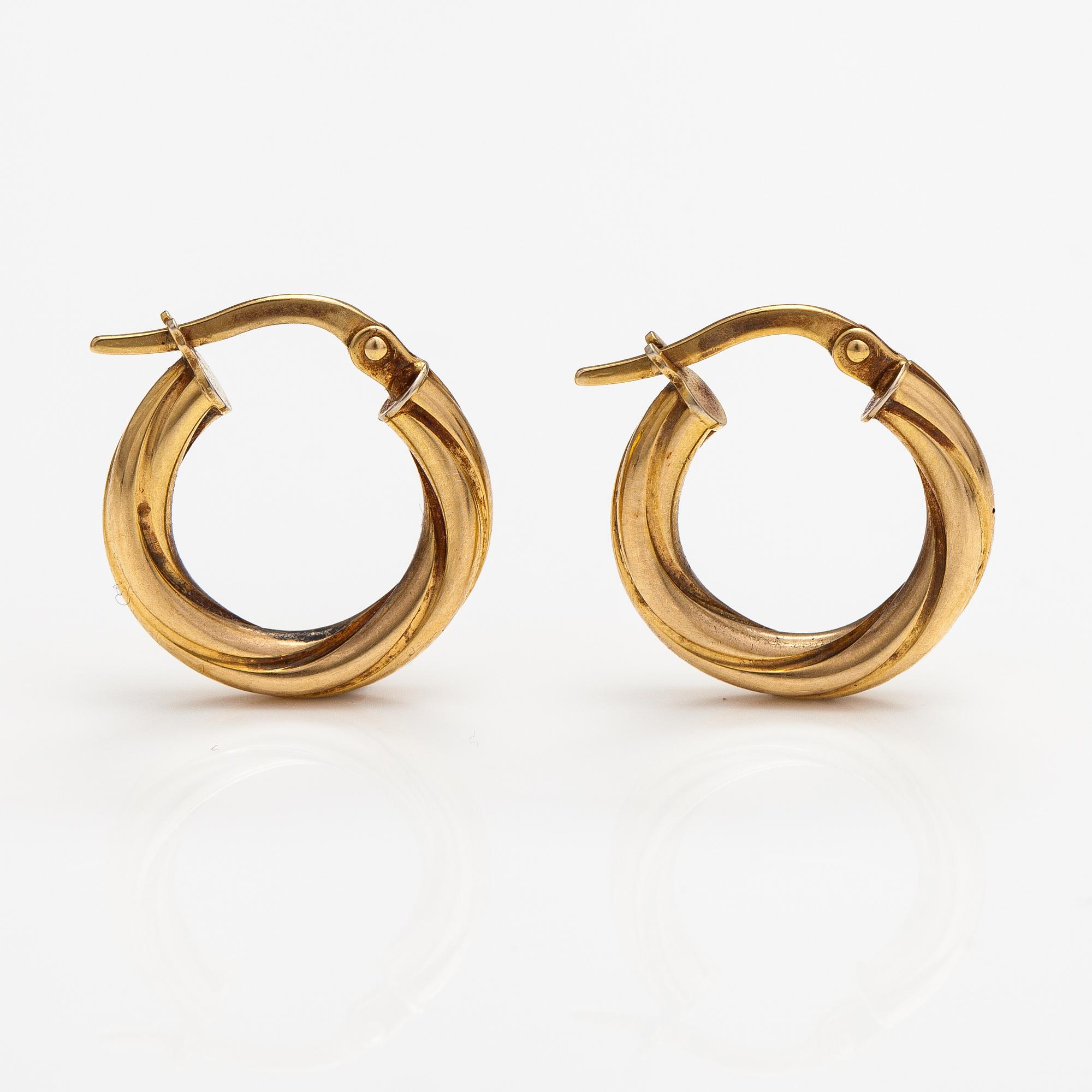 A pair of 14K gold earrings. Italy.