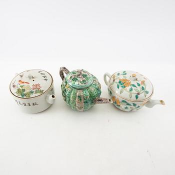 A set of three differently decorated tea pots with covers, Qing dynasty, 18century and 20th century.