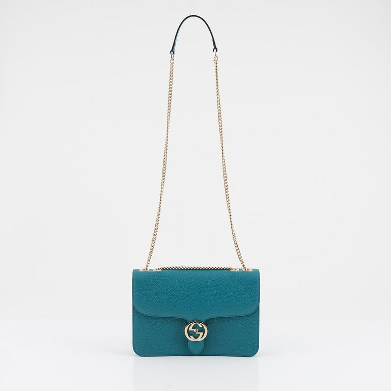 Gucci, a pebbled leather 'Interlocking G' bag.