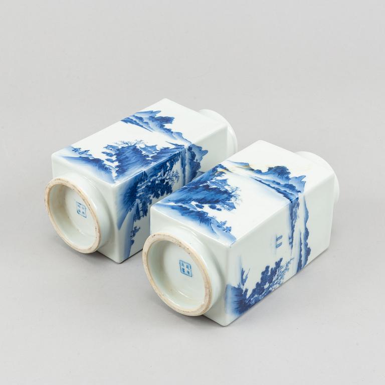 A pair of Chinese squared "cong" blue and white vases, 20th century.