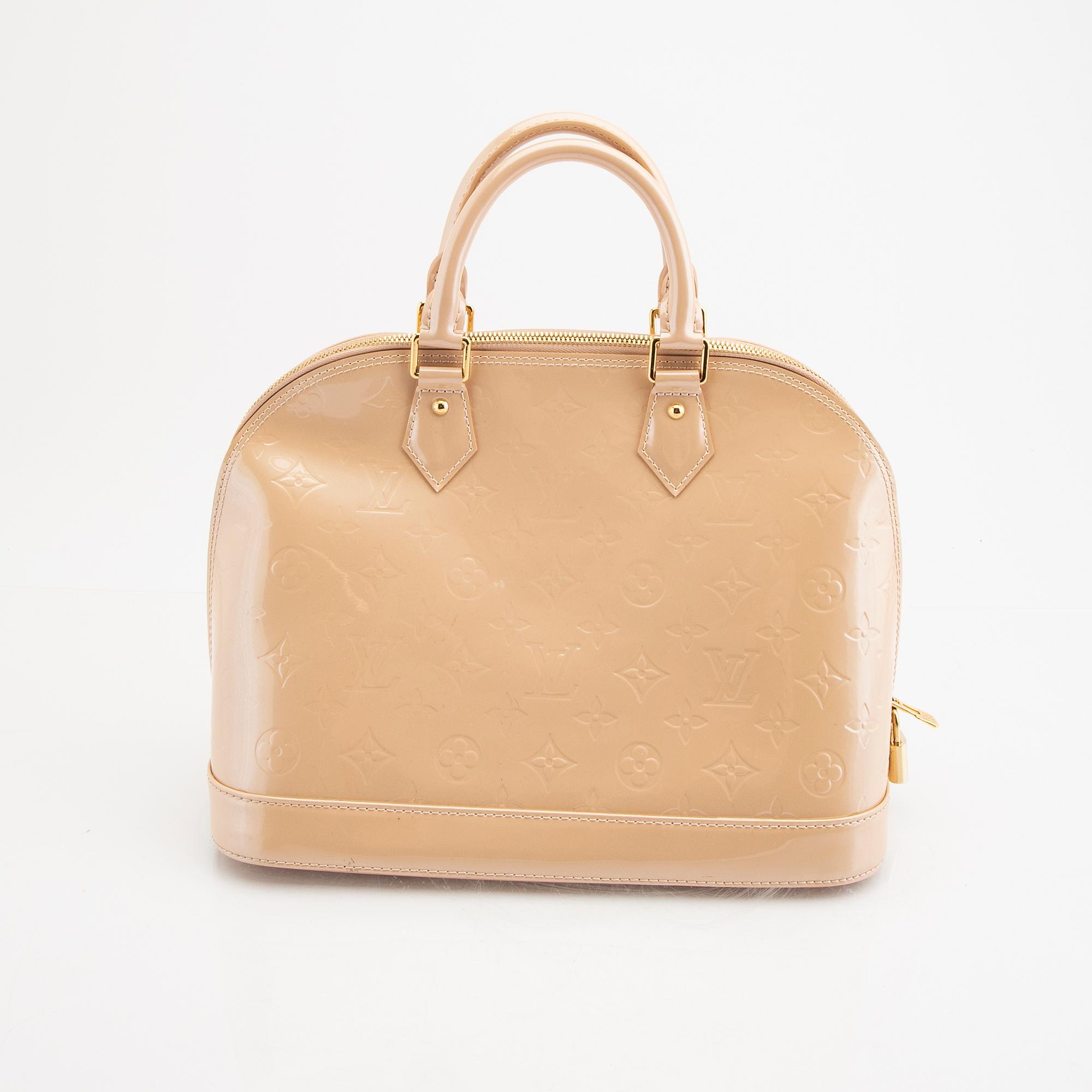 Louis Vuitton, an "Alma PM" handbag.