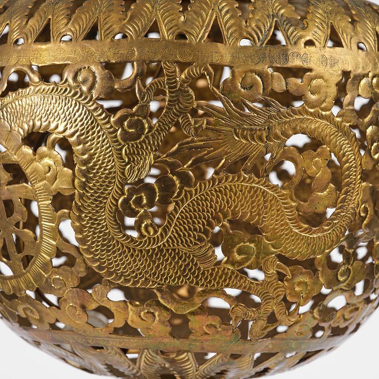 A Chinese gilt wood lantern with brass shade, Qing dynasty, 19th century.