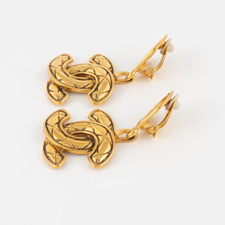 Chanel, a pair of gold tone clip-on earrings, 1990-1992.